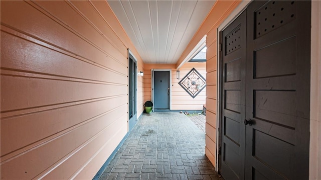 529 E Harvard Pl, Ontario, CA 91764 - hall with brick flooring and wooden walls