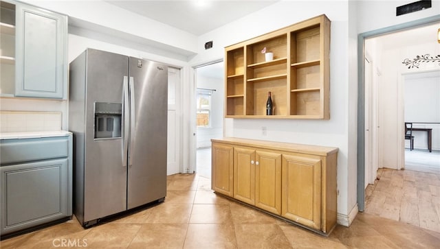 529 E Harvard Pl, Ontario, CA 91764 - kitchen with stainless steel fridge, open shelves, and tile counters