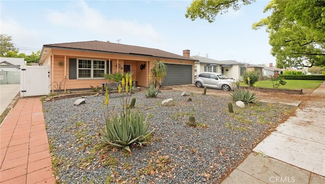 529 E Harvard Pl, Ontario, CA 91764 - single story home with an attached garage, a gate, and driveway