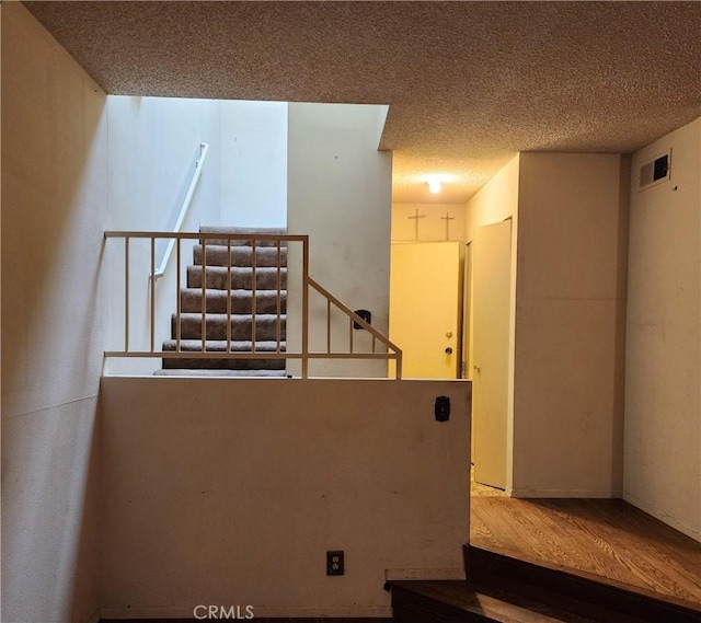 411 N Brannick Unit B, Los Angeles, CA 90063 - stairway with wood finished floors and a textured ceiling