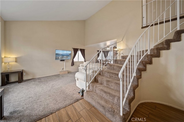 43816 Fallon Dr, Lancaster, CA 93535 - stairway featuring wood finished floors and a towering ceiling