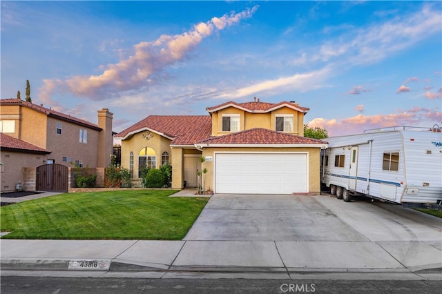 43816 Fallon Dr, Lancaster, CA 93535 - view of front of house with a gate, stucco siding, an attached garage, a lawn, and driveway