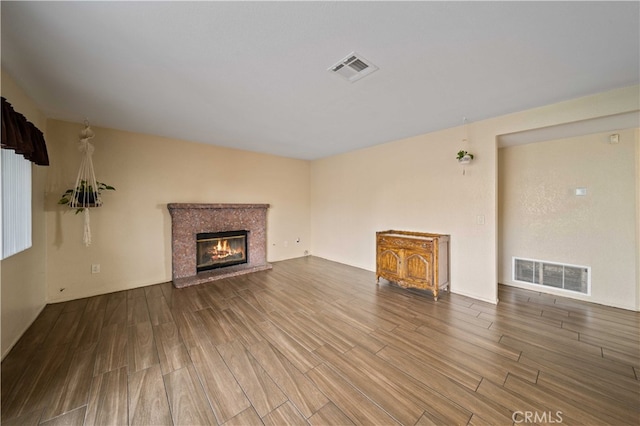 43816 Fallon Dr, Lancaster, CA 93535 - unfurnished living room featuring wood finished floors and a high end fireplace