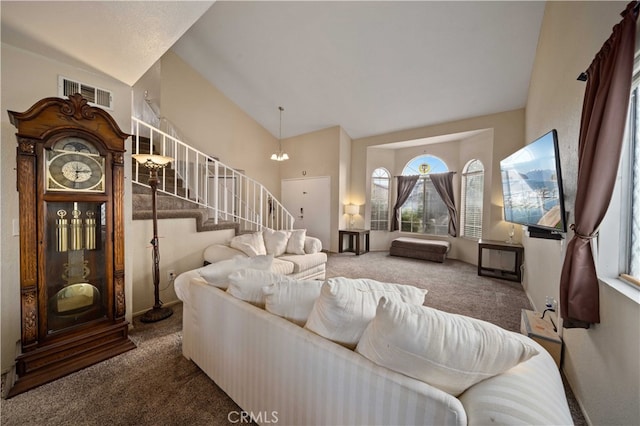 43816 Fallon Dr, Lancaster, CA 93535 - carpeted living room featuring stairway, healthy amount of natural light, and high vaulted ceiling