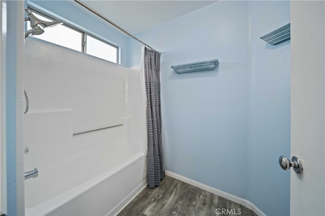 43816 Fallon Dr, Lancaster, CA 93535 - full bathroom featuring wood finished floors, shower / bath combination with curtain, and baseboards