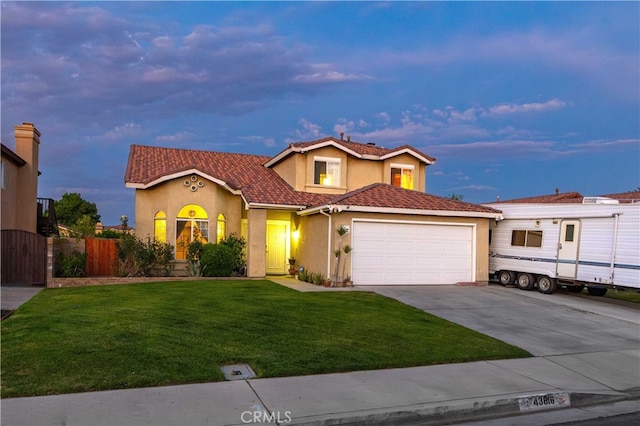 43816 Fallon Dr, Lancaster, CA 93535 - view of front facade with stucco siding, concrete driveway, an attached garage, and a tiled roof