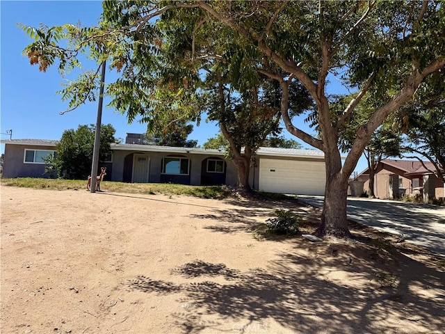 18083 Deodar St, Hesperia, CA 92345 - single story home featuring dirt driveway, a garage, and stucco siding