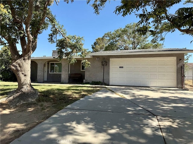 18083 Deodar St, Hesperia, CA 92345 - ranch-style home with stucco siding, driveway, an attached garage, and a front yard
