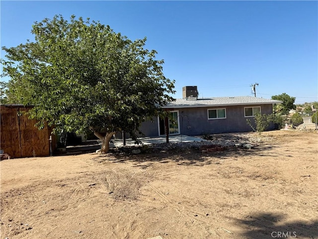 18083 Deodar St, Hesperia, CA 92345 - rear view of house featuring a patio and a chimney