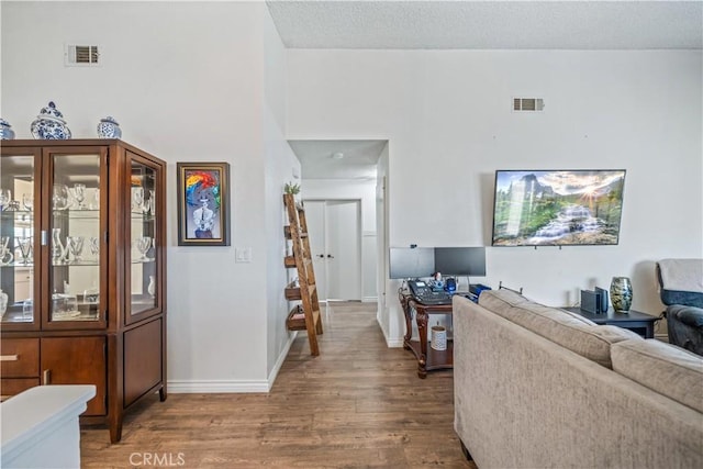 13883 Northstar Ave, Victorville, CA 92392 - living area featuring wood finished floors and a high ceiling