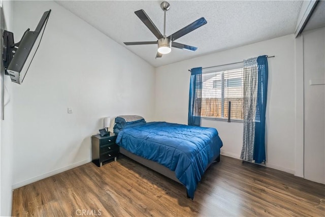 13883 Northstar Ave, Victorville, CA 92392 - bedroom featuring wood finished floors, a textured ceiling, vaulted ceiling, and a ceiling fan