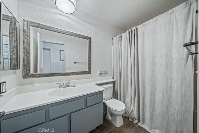 13883 Northstar Ave, Victorville, CA 92392 - bathroom featuring vanity, wood finished floors, and a shower with curtain