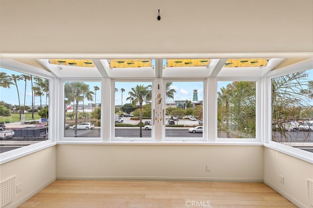 1623 W Balboa Blvd, Newport Beach, CA 92663 - unfurnished sunroom with wood finished floors, healthy amount of natural light, and baseboards