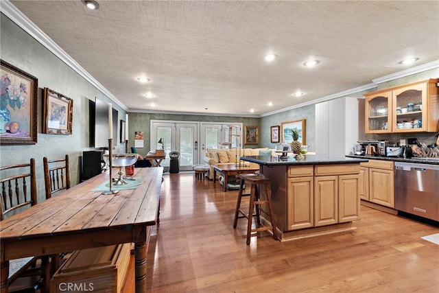 1623 W Balboa Blvd, Newport Beach, CA 92663 - kitchen with stainless steel dishwasher, crown molding, dark countertops, a center island, and light wood-type flooring