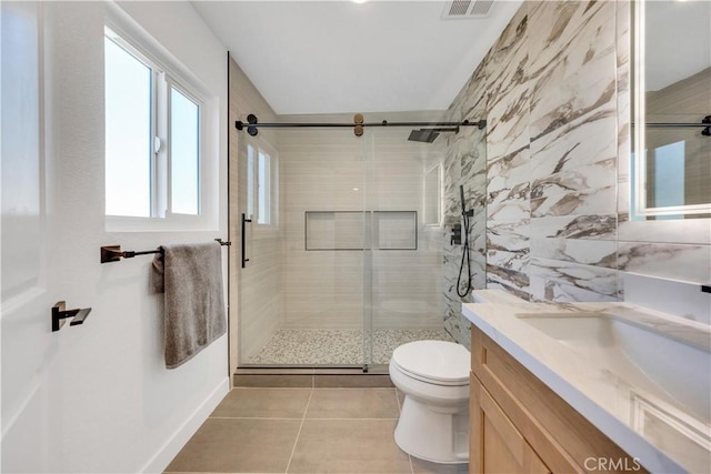 144 N Dommer Ave, Walnut, CA 91789 - full bathroom with toilet, vanity, a stall shower, tile patterned floors, and tile walls