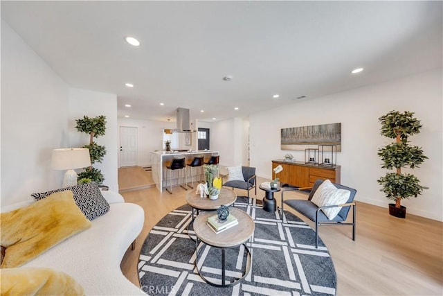 144 N Dommer Ave, Walnut, CA 91789 - living room featuring light wood-style flooring, recessed lighting, and baseboards