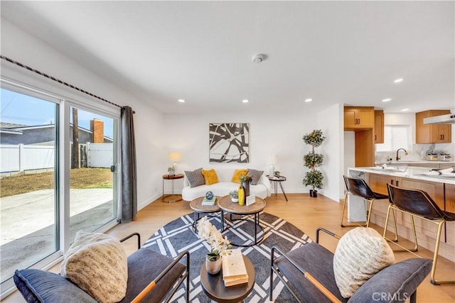 144 N Dommer Ave, Walnut, CA 91789 - living room featuring light wood-style floors, recessed lighting, and baseboards
