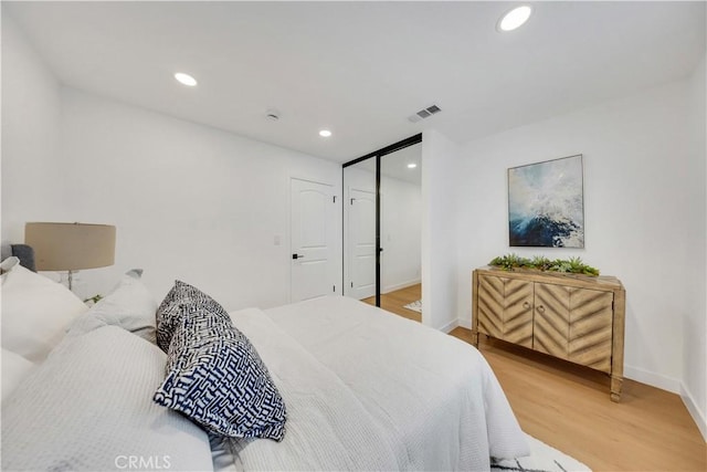 144 N Dommer Ave, Walnut, CA 91789 - bedroom featuring light wood-type flooring, baseboards, recessed lighting, and a closet