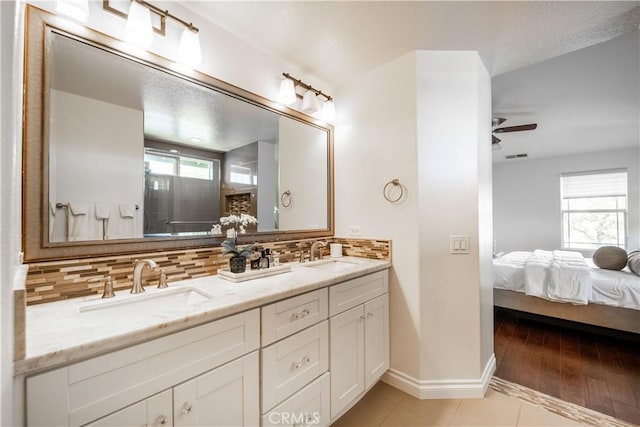1803 Chambers Ct, Fullerton, CA 92833 - full bath featuring double vanity, backsplash, ensuite bath, a ceiling fan, and plenty of natural light