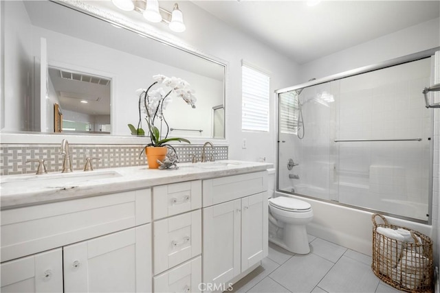 1803 Chambers Ct, Fullerton, CA 92833 - full bath featuring toilet, double vanity, backsplash, bath / shower combo with glass door, and tile patterned flooring