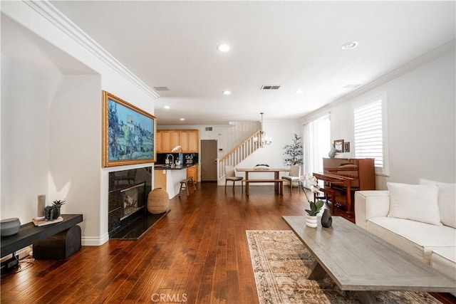 1803 Chambers Ct, Fullerton, CA 92833 - living room with stairs, ornamental molding, recessed lighting, dark wood-style floors, and a tile fireplace