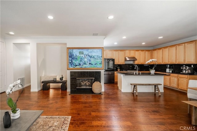 1803 Chambers Ct, Fullerton, CA 92833 - kitchen featuring light brown cabinetry, dark countertops, smart refrigerator, under cabinet range hood, and crown molding