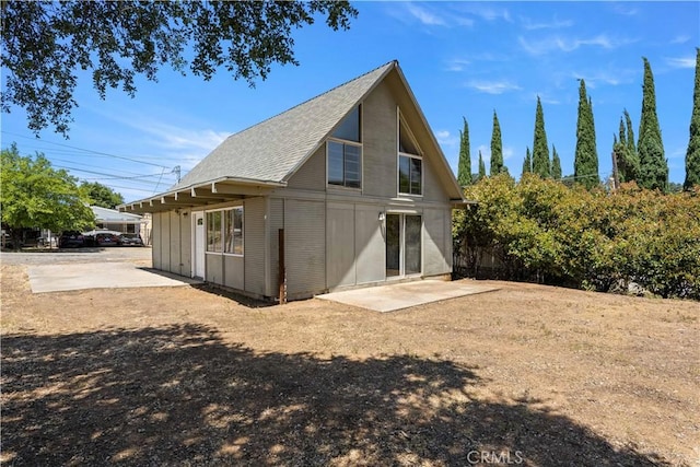 3996 Leonore Ave, Clearlake, CA 95422 - rear view of property with a patio area and a shingled roof