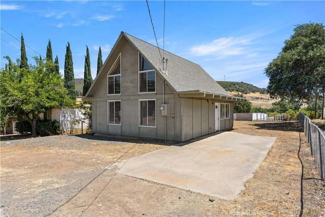 3996 Leonore Ave, Clearlake, CA 95422 - back of property featuring a patio area and a shingled roof