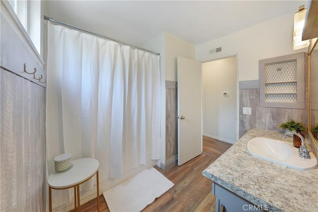 338 E Palmdale Ave Unit 4, Orange, CA 92865 - bathroom featuring vanity, wood finished floors, and curtained shower