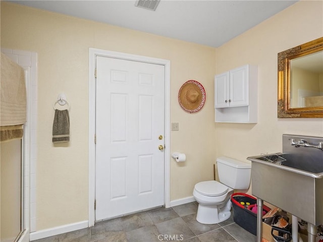 49333 Riverside Rd, Newberry Springs, CA 92365 - full bath with baseboards, toilet, a shower with shower door, and a sink