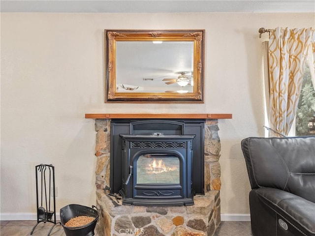 49333 Riverside Rd, Newberry Springs, CA 92365 - detailed view of baseboards, a ceiling fan, and a wood stove