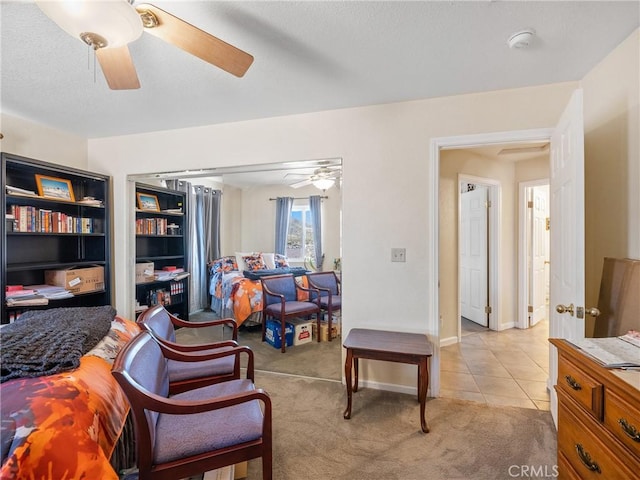49333 Riverside Rd, Newberry Springs, CA 92365 - bedroom featuring light carpet, light tile patterned floors, and a ceiling fan