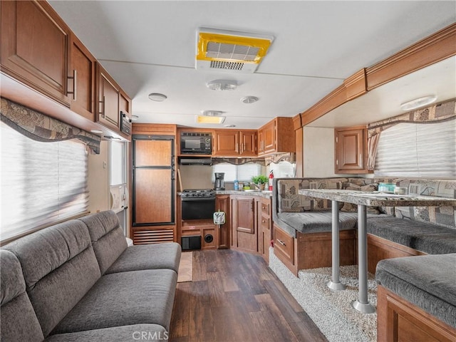 49333 Riverside Rd, Newberry Springs, CA 92365 - kitchen with built in appliances, open floor plan, brown cabinets, and dark wood finished floors