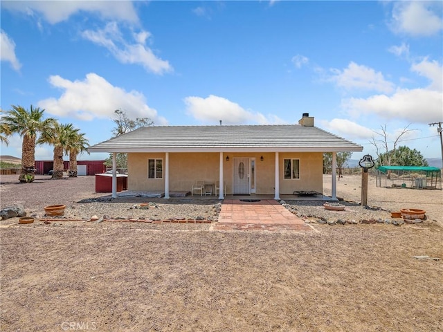 49333 Riverside Rd, Newberry Springs, CA 92365 - view of front of property featuring stucco siding, a tiled roof, and a chimney