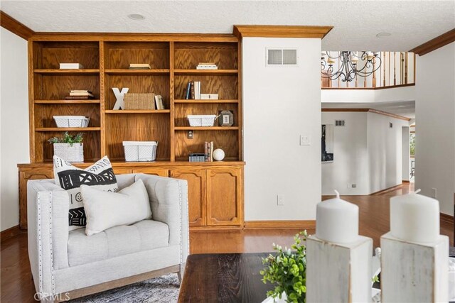 32022 Via Pavo Real, Coto De Caza, CA 92679 - living area with a chandelier, wood finished floors, ornamental molding, baseboards, and a textured ceiling