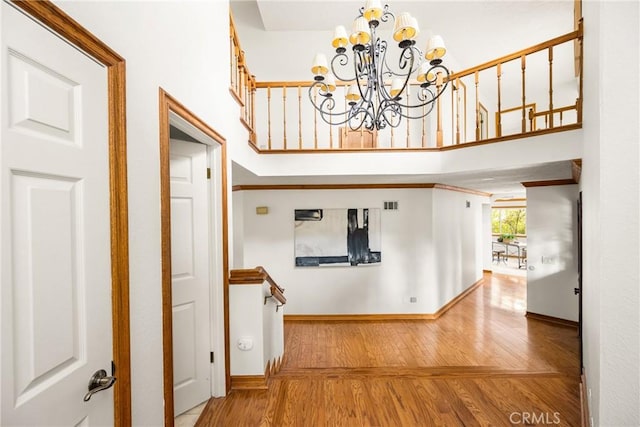 32022 Via Pavo Real, Coto De Caza, CA 92679 - corridor with wood finished floors, a chandelier, baseboards, and a high ceiling