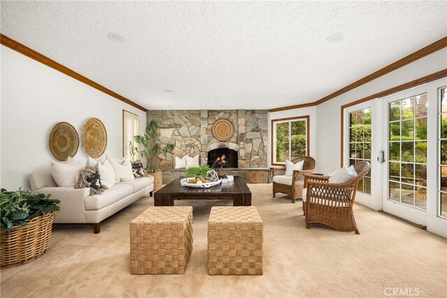 32022 Via Pavo Real, Coto De Caza, CA 92679 - living area with crown molding, light colored carpet, a textured ceiling, and a stone fireplace