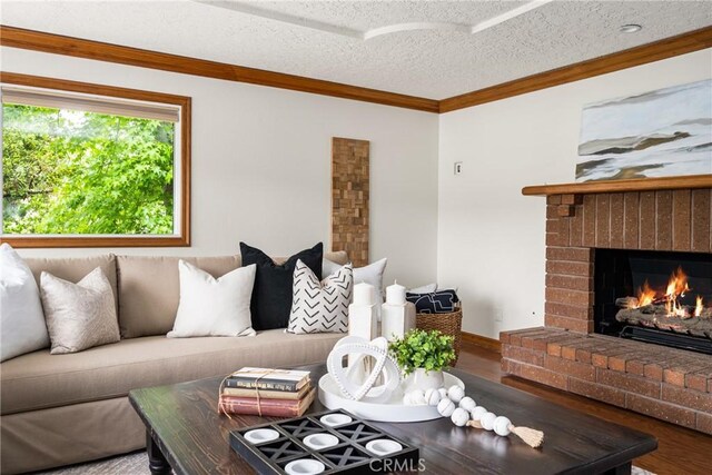 32022 Via Pavo Real, Coto De Caza, CA 92679 - living area with a textured ceiling, a brick fireplace, ornamental molding, and wood finished floors