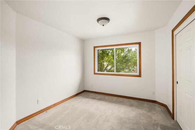 32022 Via Pavo Real, Coto De Caza, CA 92679 - unfurnished bedroom with light colored carpet and baseboards