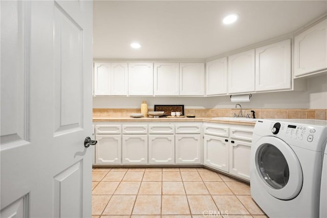 32022 Via Pavo Real, Coto De Caza, CA 92679 - washroom with washer / clothes dryer, cabinet space, light tile patterned floors, and recessed lighting