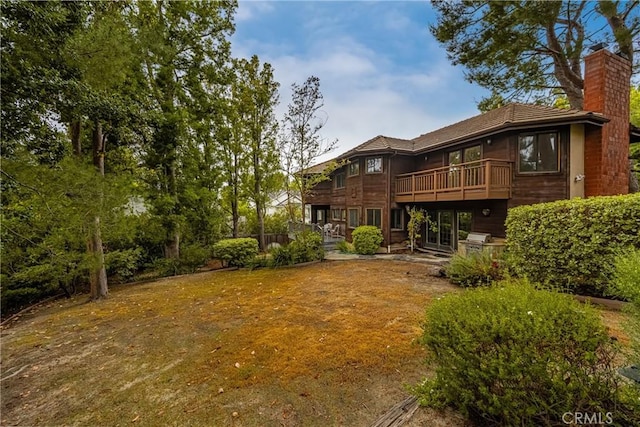 32022 Via Pavo Real, Coto De Caza, CA 92679 - rear view of house with a chimney and a balcony