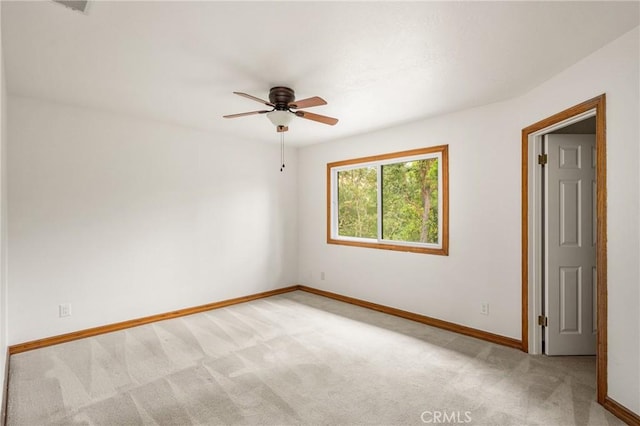 32022 Via Pavo Real, Coto De Caza, CA 92679 - spare room featuring light colored carpet, baseboards, and ceiling fan