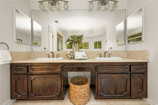 32022 Via Pavo Real, Coto De Caza, CA 92679 - full bathroom featuring double vanity, tile patterned floors, and baseboards