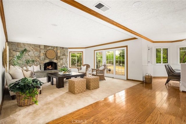32022 Via Pavo Real, Coto De Caza, CA 92679 - living room with light wood-style floors, a fireplace, ornamental molding, a textured ceiling, and baseboards