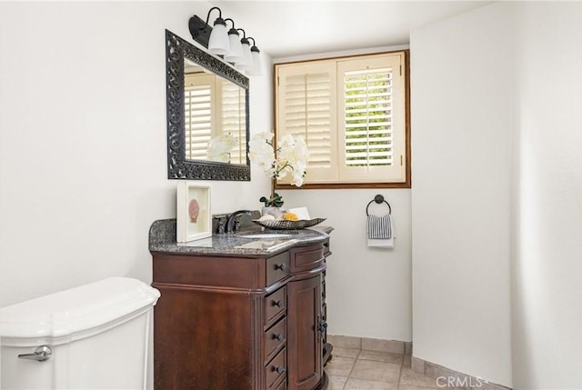 32022 Via Pavo Real, Coto De Caza, CA 92679 - half bathroom with toilet, vanity, baseboards, and tile patterned flooring