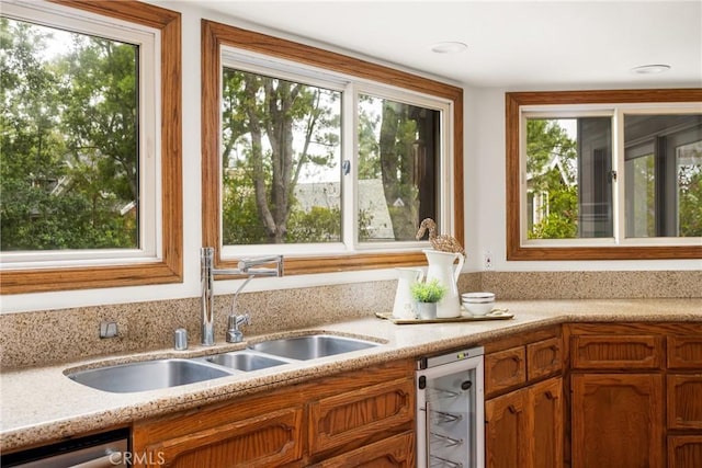 32022 Via Pavo Real, Coto De Caza, CA 92679 - kitchen with healthy amount of natural light, a sink, and brown cabinets