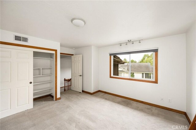 32022 Via Pavo Real, Coto De Caza, CA 92679 - unfurnished bedroom featuring light colored carpet, baseboards, and a closet