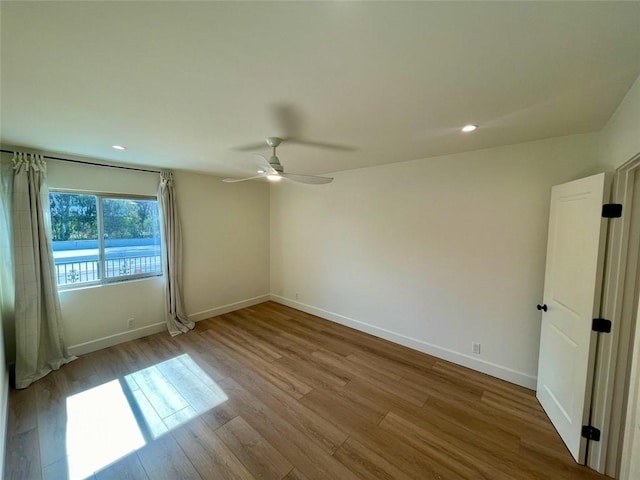 3972 Jackdaw St Unit 303, San Diego, CA 92103 - spare room featuring a ceiling fan, wood finished floors, baseboards, and recessed lighting