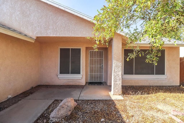 1330 Santa Fe Cir, Needles, CA 92363 - entrance to property featuring stucco siding and a patio