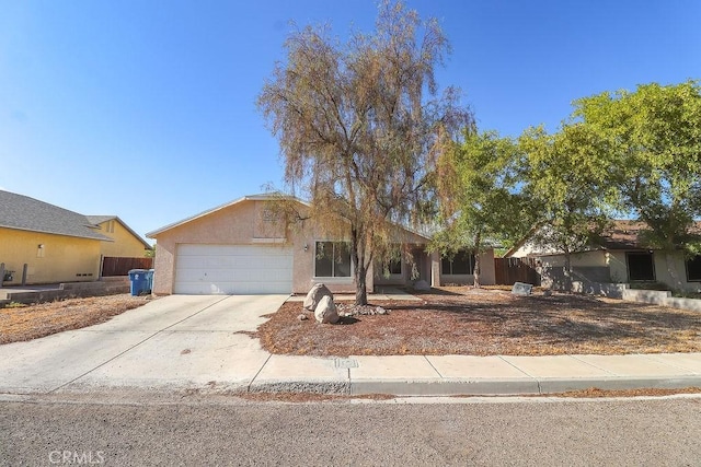 1330 Santa Fe Cir, Needles, CA 92363 - single story home featuring a garage, driveway, and stucco siding